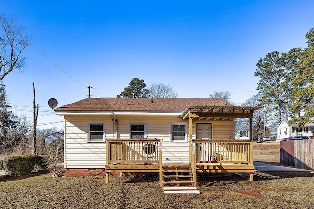 back of house featuring a pergola and a deck