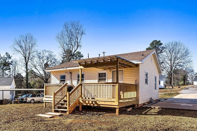 view of front facade with a wooden deck