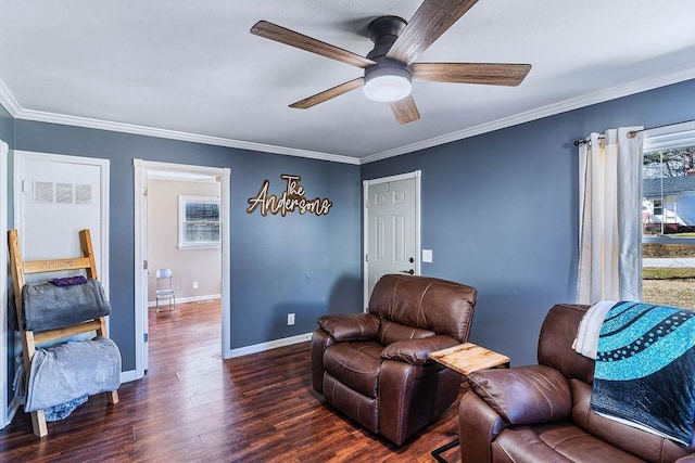 living area with crown molding, ceiling fan, and dark hardwood / wood-style floors