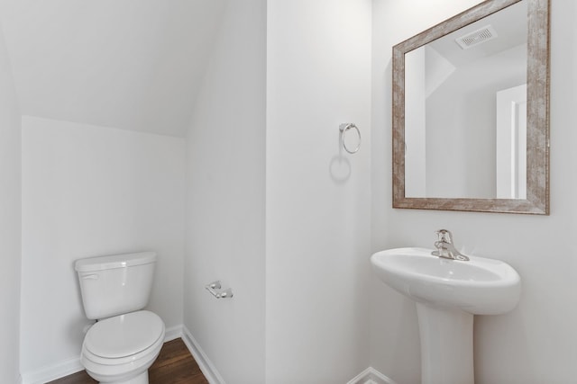 bathroom with wood-type flooring and toilet