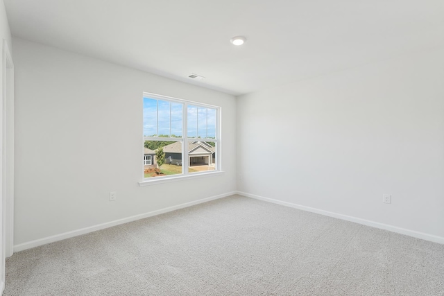 spare room featuring carpet flooring