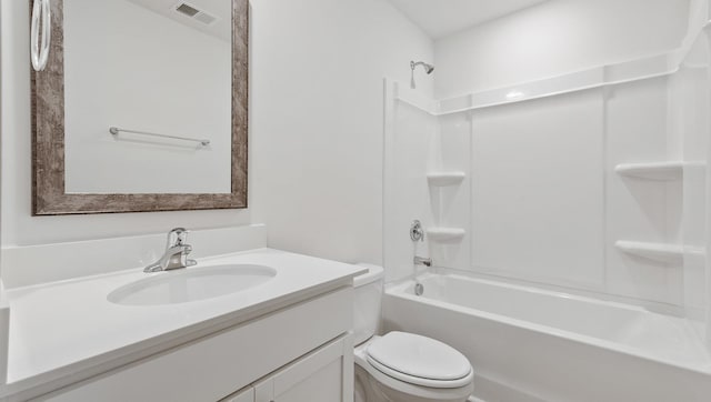 full bathroom featuring toilet, vanity, and  shower combination