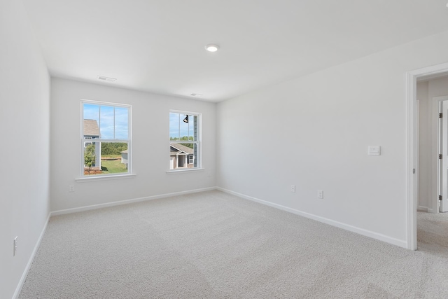 empty room featuring light carpet