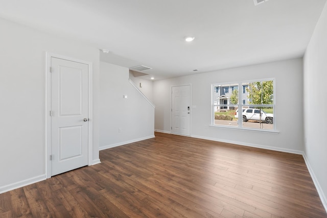 unfurnished room with dark hardwood / wood-style floors