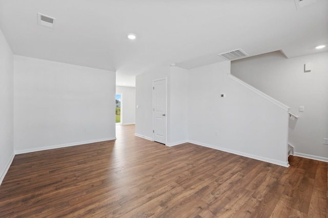 unfurnished living room with dark hardwood / wood-style flooring