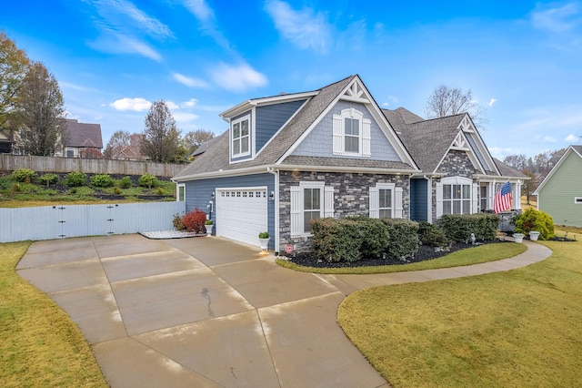 view of front of home with a garage and a front lawn