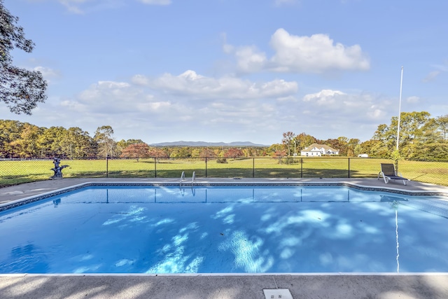 view of swimming pool featuring a mountain view