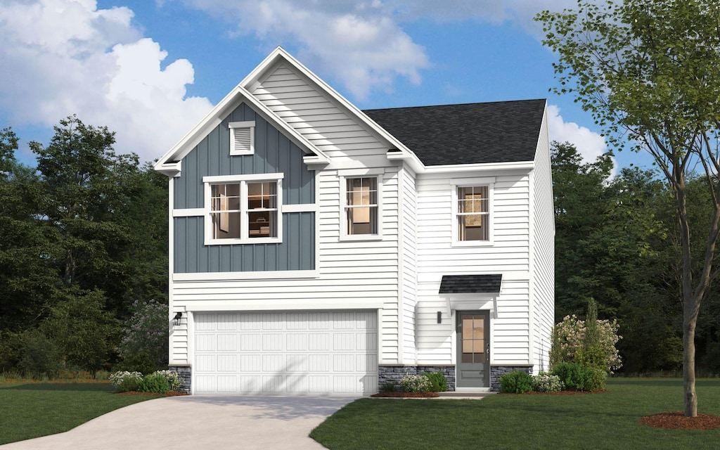 view of front facade with a garage and a front yard