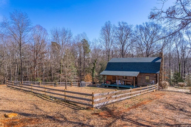 view of yard with a rural view