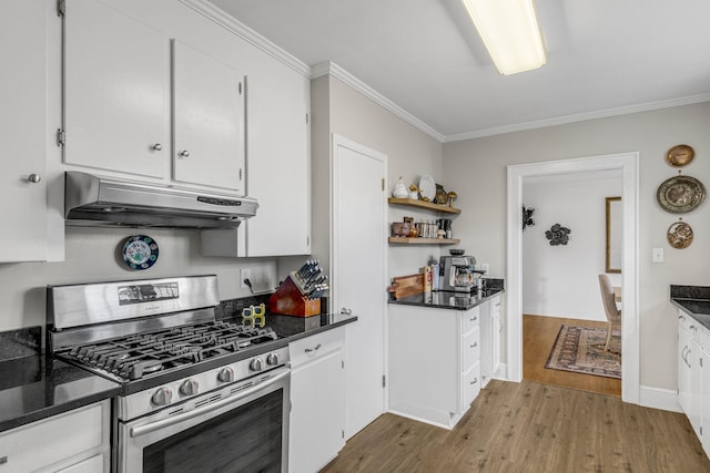 kitchen featuring hardwood / wood-style floors, white cabinetry, ornamental molding, and stainless steel range with gas stovetop