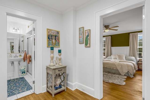 hall featuring crown molding and hardwood / wood-style floors