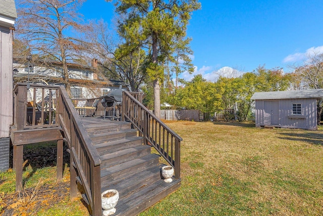 view of yard with a wooden deck and a storage unit