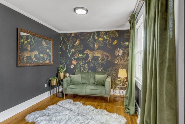 living area featuring crown molding and wood-type flooring