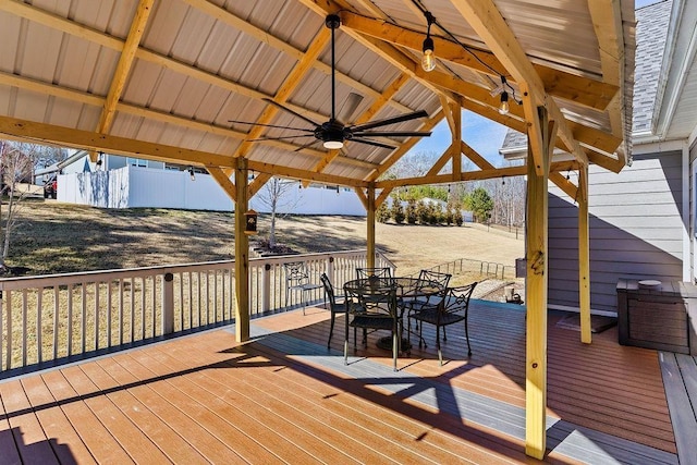 wooden deck featuring a gazebo and ceiling fan