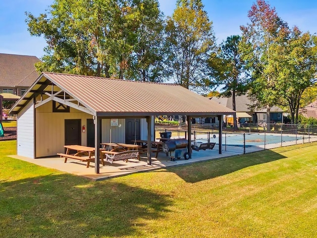 view of home's community featuring a swimming pool, a yard, and a patio area