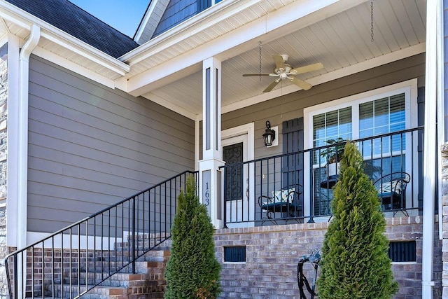 entrance to property featuring ceiling fan and a porch