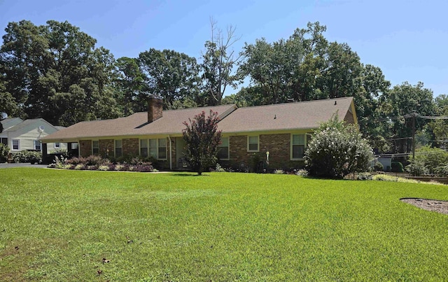 ranch-style house with a front lawn