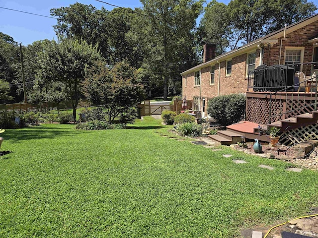 view of yard featuring a wooden deck