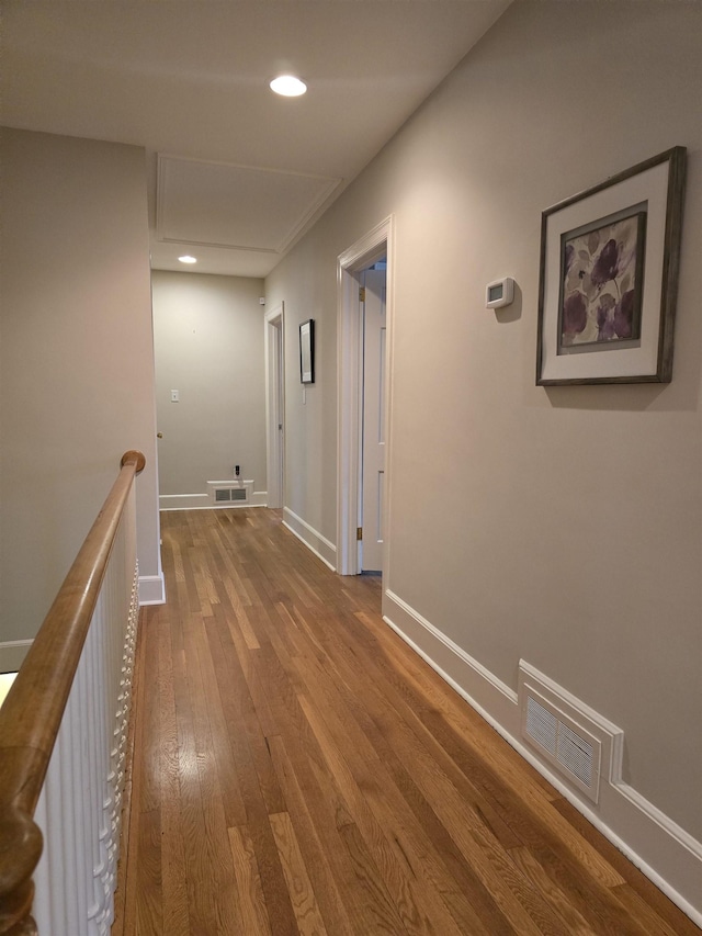 hall with wood-type flooring