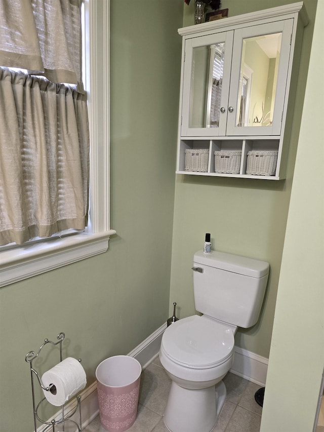 bathroom featuring tile patterned floors and toilet