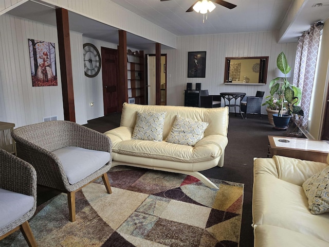 carpeted living room featuring ceiling fan