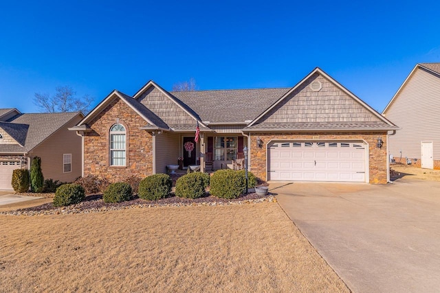 view of front of house featuring a garage and covered porch