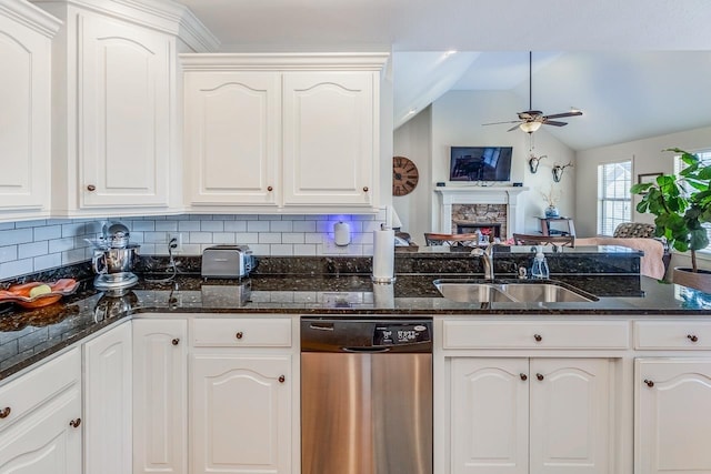 kitchen featuring sink, stainless steel dishwasher, white cabinets, and ceiling fan