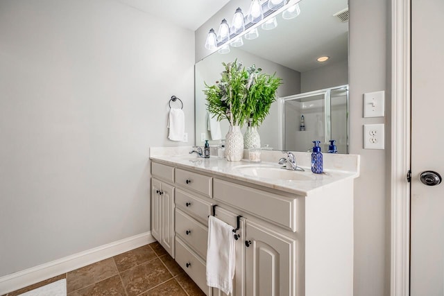 bathroom featuring walk in shower and vanity