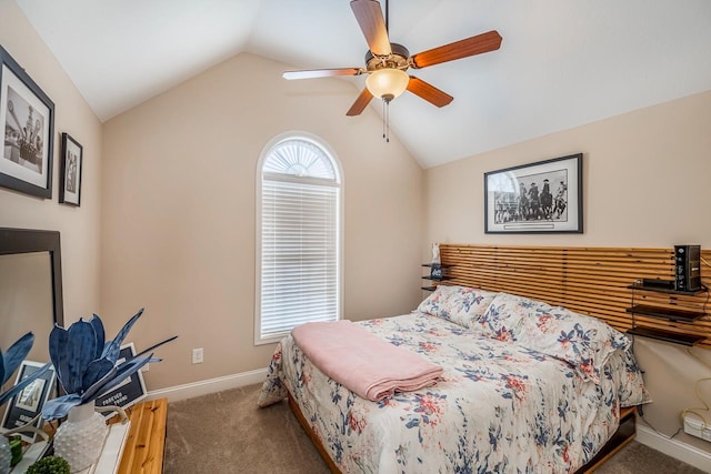 bedroom featuring dark colored carpet, lofted ceiling, and ceiling fan