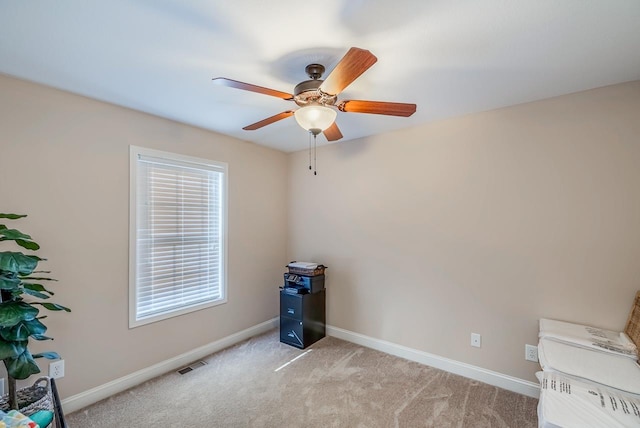 miscellaneous room featuring ceiling fan and light colored carpet