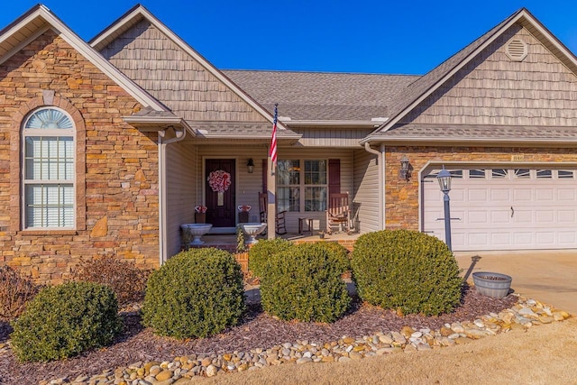 view of front of property featuring a garage and covered porch