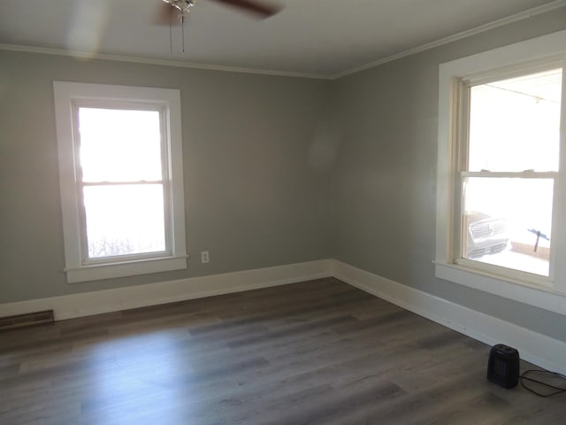 unfurnished room featuring ornamental molding, ceiling fan, and dark hardwood / wood-style flooring