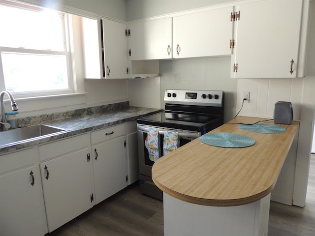 kitchen with white cabinetry, stainless steel electric stove, sink, and dark wood-type flooring