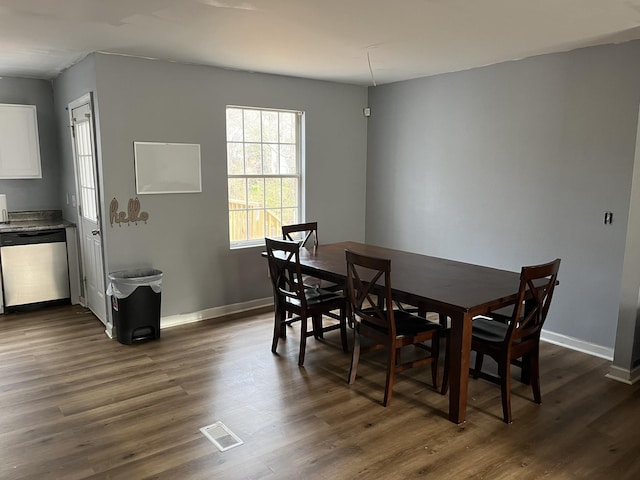 dining area with dark wood-type flooring