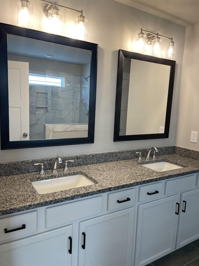 bathroom featuring vanity and a shower with shower door