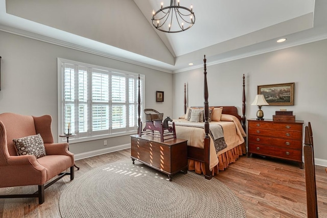 bedroom with crown molding, high vaulted ceiling, hardwood / wood-style floors, and a chandelier