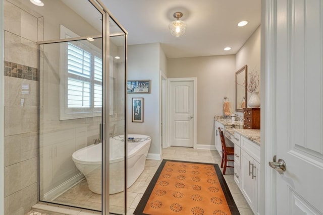 bathroom featuring tile patterned floors, vanity, and plus walk in shower