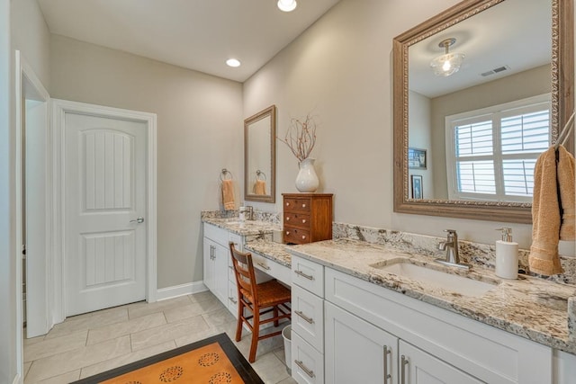 bathroom featuring vanity and tile patterned flooring