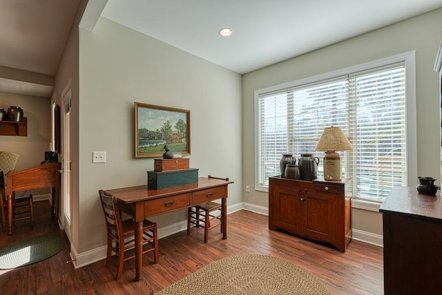 office area with plenty of natural light and hardwood / wood-style floors