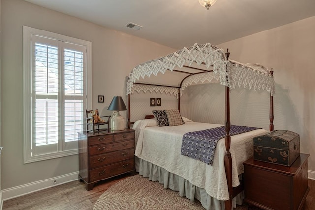 bedroom featuring wood-type flooring