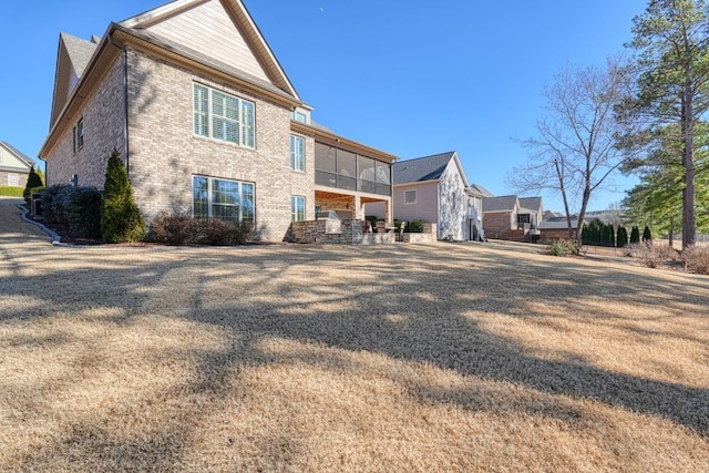 back of property featuring a sunroom