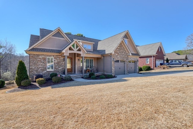 craftsman-style home with a porch and a garage