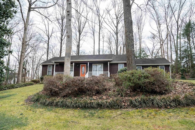 single story home featuring a front yard