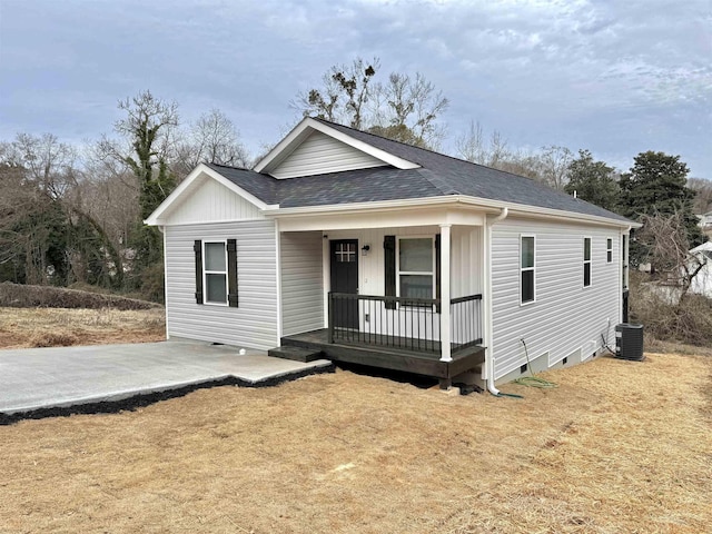 view of front of home with cooling unit and a porch