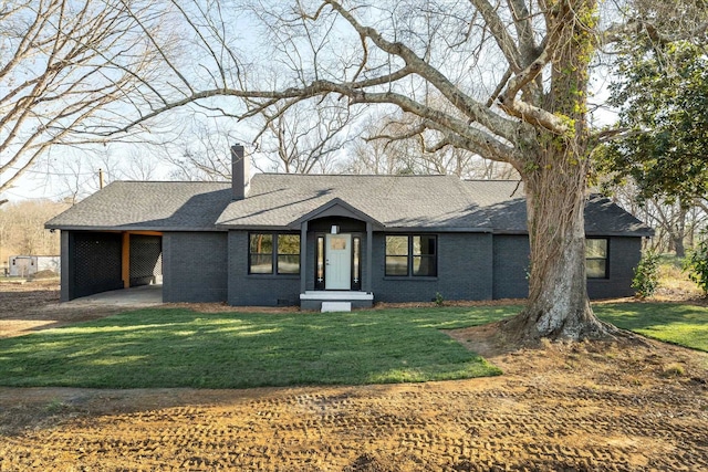 single story home with a front yard and a carport