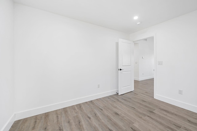 unfurnished room featuring light wood-type flooring