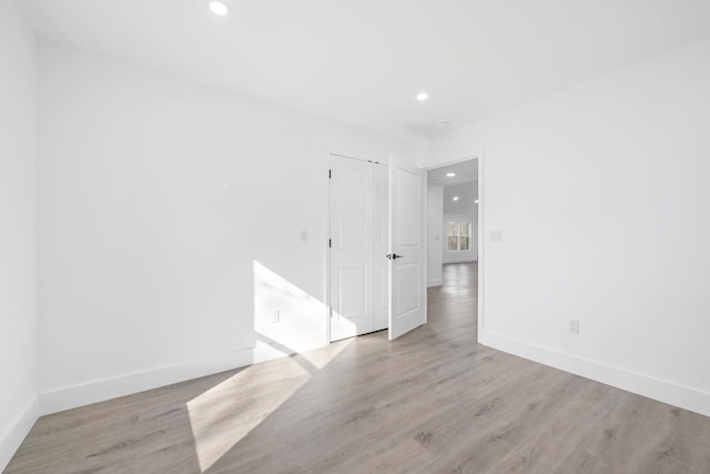 unfurnished room featuring light hardwood / wood-style flooring