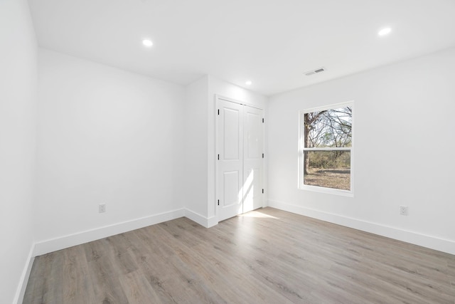 unfurnished room featuring light hardwood / wood-style floors