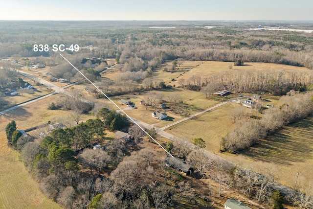 birds eye view of property featuring a rural view