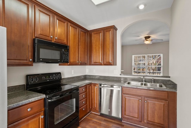 kitchen featuring ceiling fan, dark hardwood / wood-style flooring, sink, and black appliances